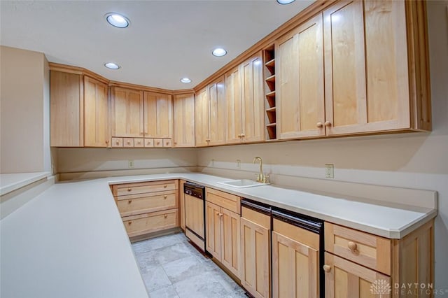 kitchen with light brown cabinets, sink, light tile patterned floors, and stainless steel dishwasher