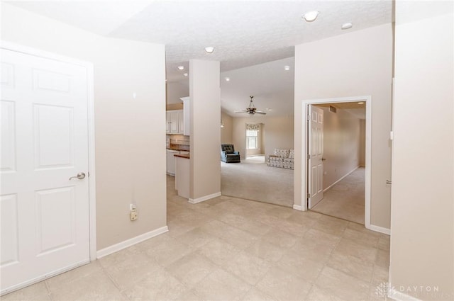 corridor with light colored carpet