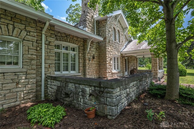 view of property exterior featuring a patio area