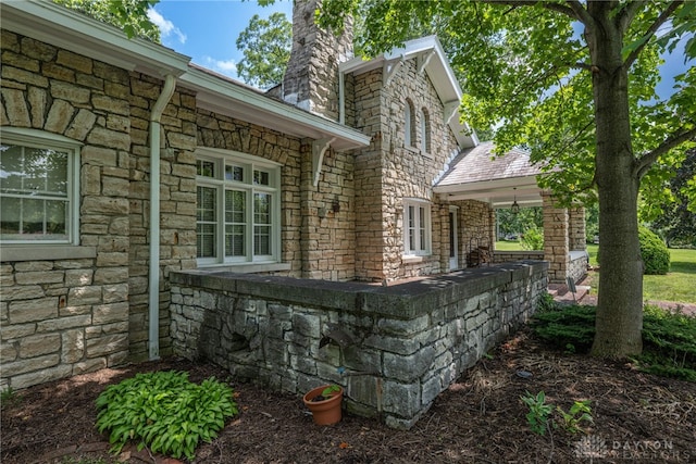 410 S Linden Ave, Miamisburg, OH 45342 - view of side of property featuring stone siding and a chimney
