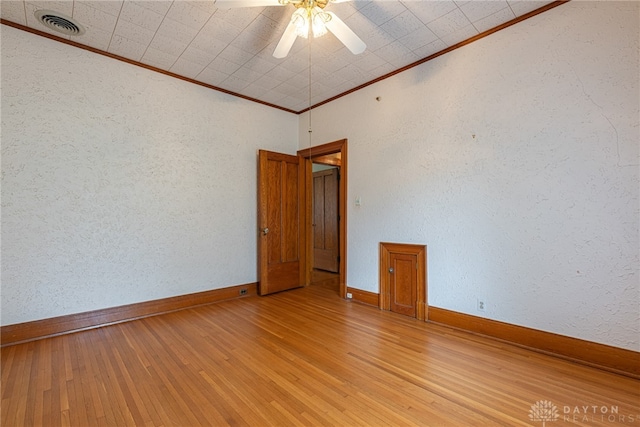 410 S Linden Ave, Miamisburg, OH 45342 - empty room featuring baseboards, visible vents, crown molding, and wood finished floors