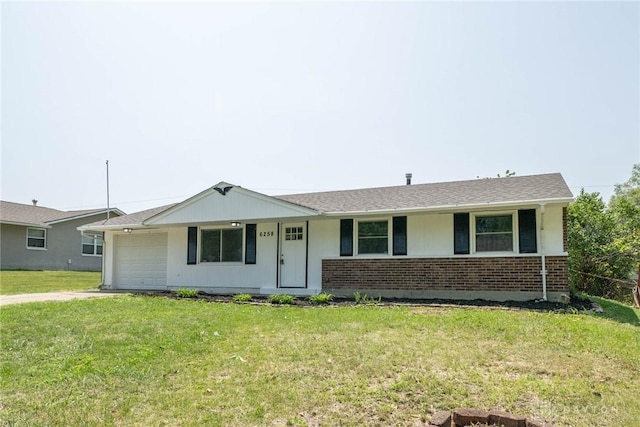 ranch-style home with a front lawn and a garage