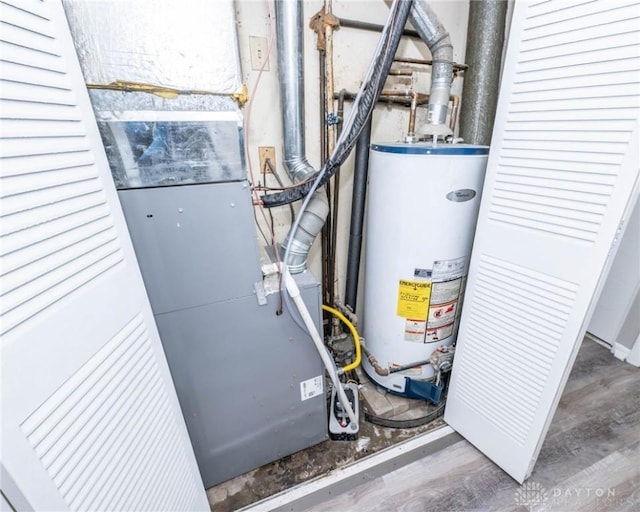 utility room featuring water heater