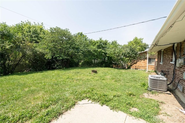 view of yard featuring central air condition unit