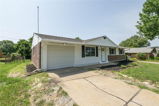 ranch-style home with covered porch, a front yard, and a garage