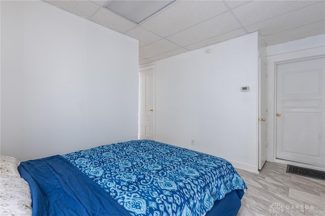 bedroom with a drop ceiling