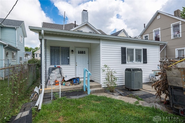 bungalow-style home featuring cooling unit