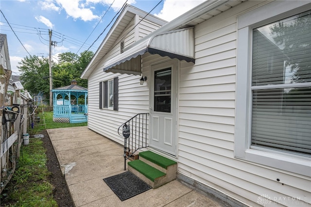 property entrance featuring a patio