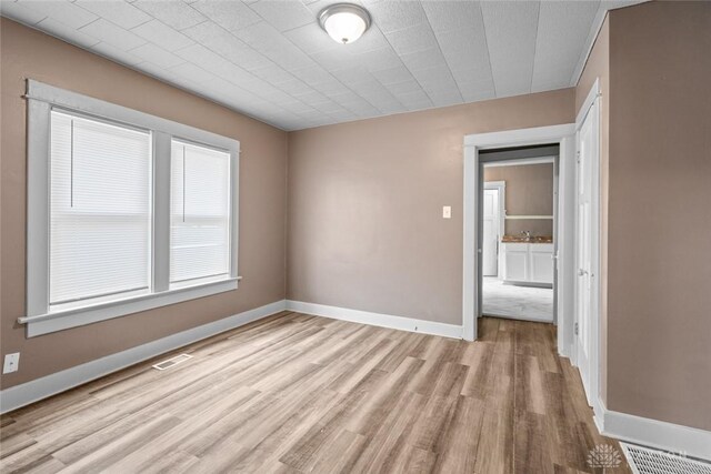 empty room with light wood-type flooring