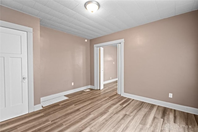 unfurnished room featuring wood-type flooring