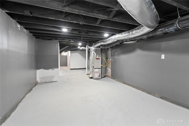 basement featuring heating unit