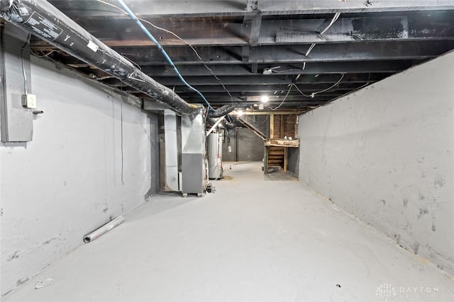 basement with gas water heater and heating unit