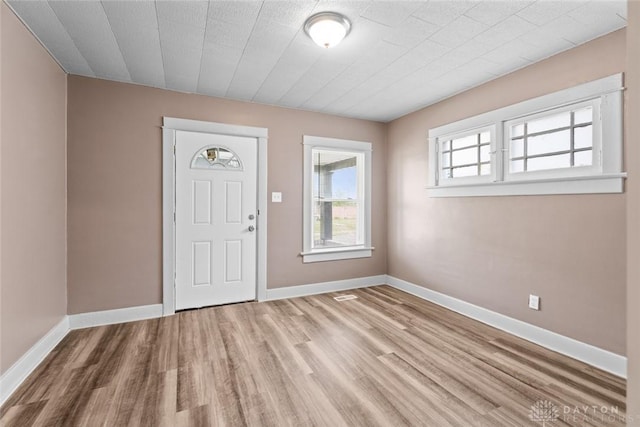 foyer entrance with light hardwood / wood-style flooring