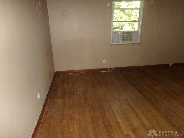 empty room featuring dark hardwood / wood-style floors