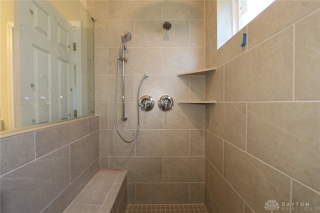 bathroom with tiled shower