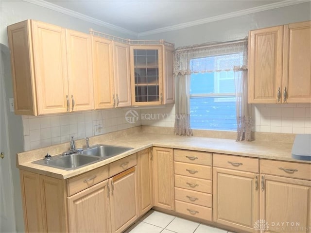 kitchen featuring light brown cabinetry, sink, decorative backsplash, and light tile patterned floors