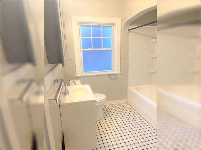 full bathroom featuring vanity, toilet, tile patterned floors, and bathing tub / shower combination