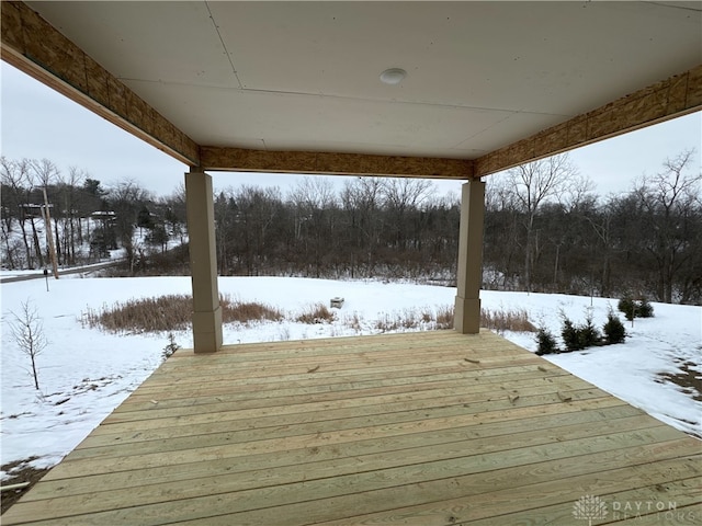 view of snow covered deck