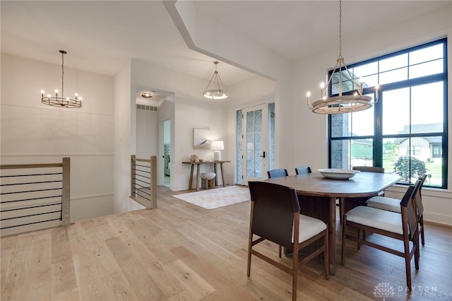 dining room with light hardwood / wood-style flooring