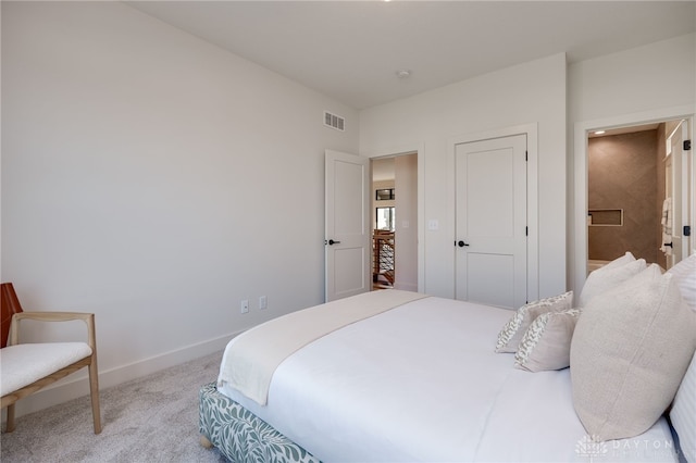 bedroom featuring light colored carpet