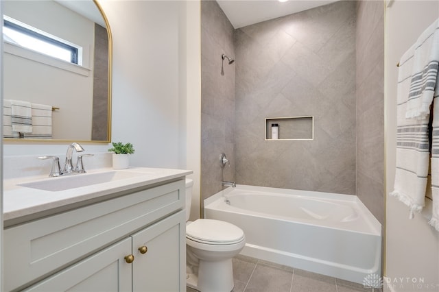 full bathroom with vanity, toilet, tiled shower / bath combo, and tile patterned flooring