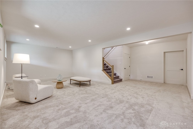 unfurnished room with light colored carpet