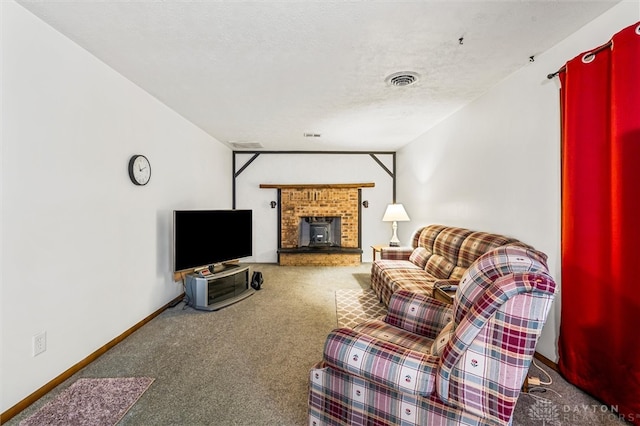 living room featuring a textured ceiling, carpet floors, and a fireplace