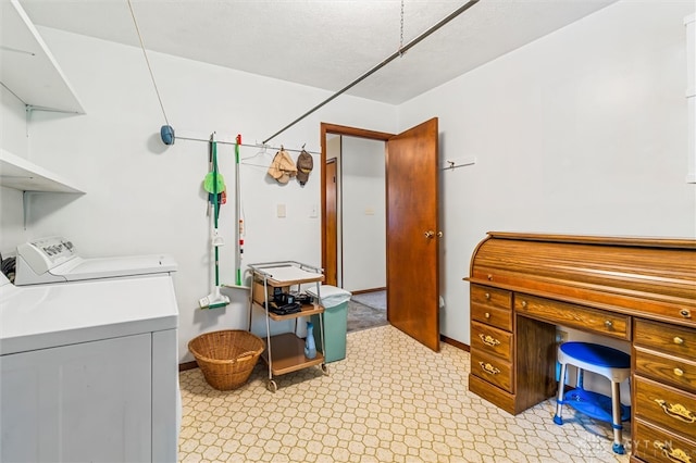 laundry area with washing machine and clothes dryer and light tile patterned floors