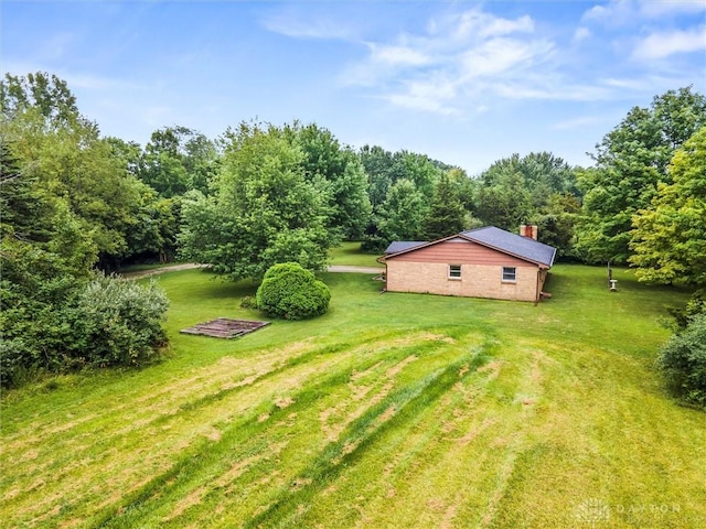 view of yard with a wooded view