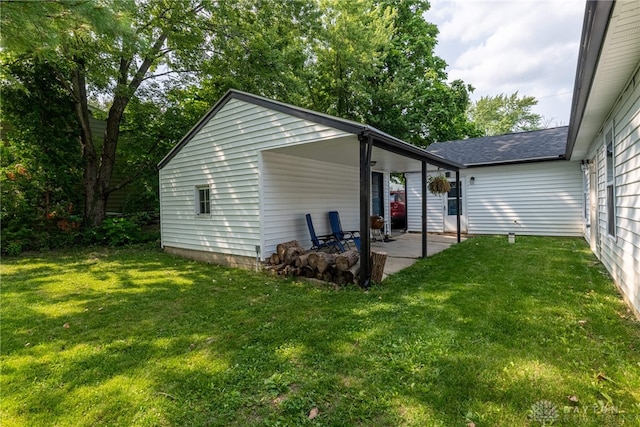 exterior space featuring a yard and a patio