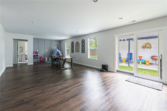 dining area with dark hardwood / wood-style flooring