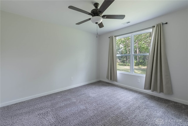 unfurnished room with ceiling fan and carpet floors