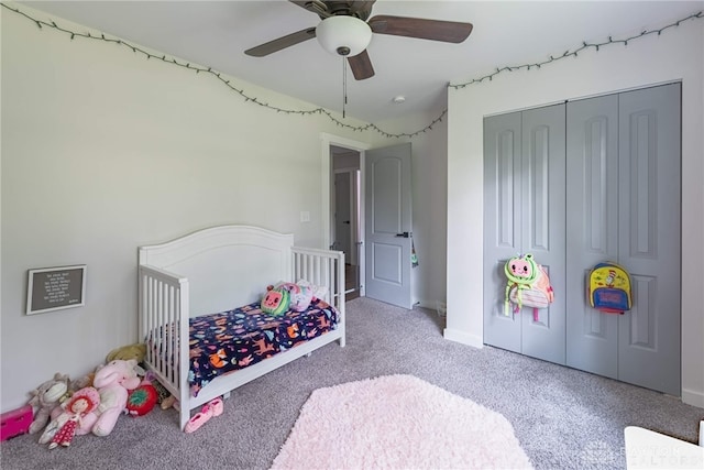 carpeted bedroom with a closet and ceiling fan