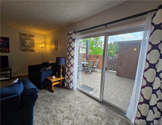 living room with carpet and a textured ceiling