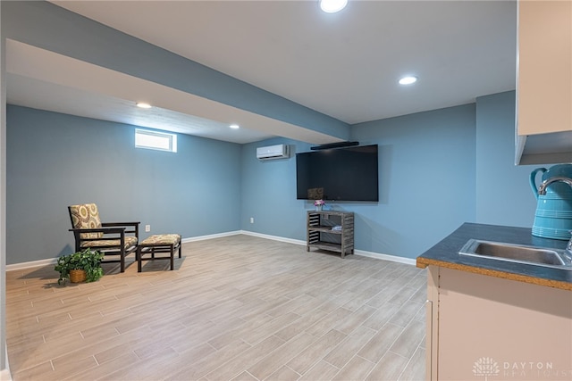 interior space featuring a wall mounted air conditioner and light wood-type flooring