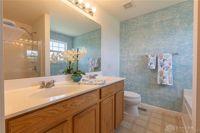 bathroom with dual vanity, tile patterned flooring, and toilet