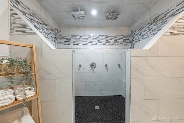 bathroom with a tile shower