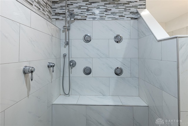 bathroom with a tile shower