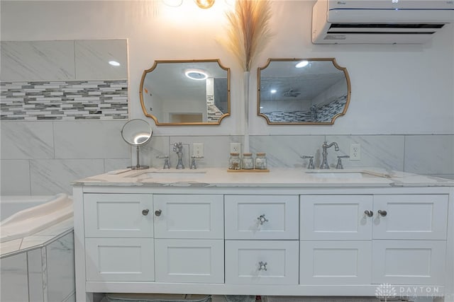 bathroom featuring an AC wall unit, tasteful backsplash, tile walls, and double vanity