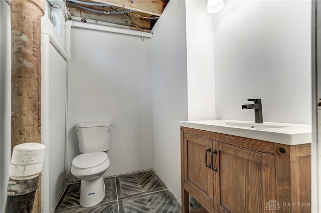 bathroom with toilet and vanity