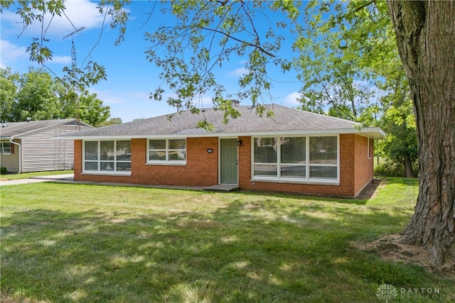 ranch-style house with a front lawn