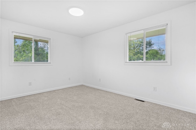 empty room featuring carpet flooring