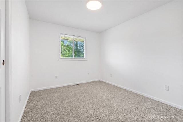 unfurnished room with carpet flooring