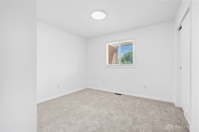 empty room with carpet flooring