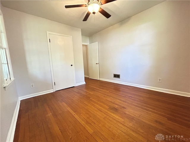 spare room with ceiling fan and wood-type flooring