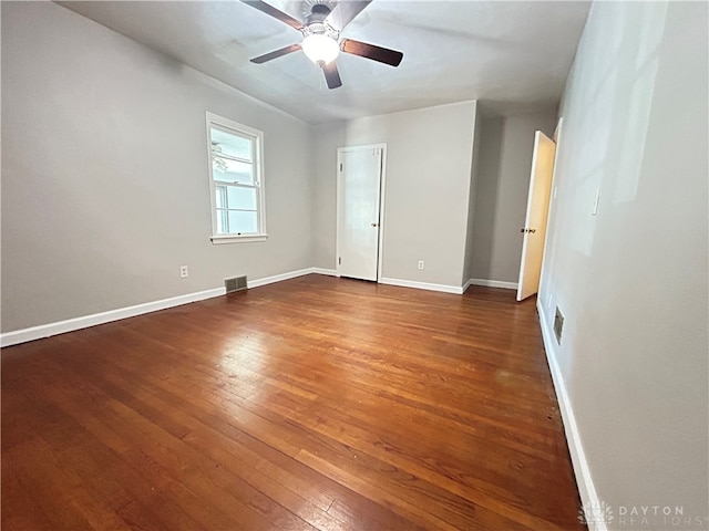 spare room with hardwood / wood-style flooring and ceiling fan