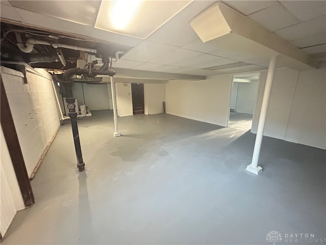 basement featuring a drop ceiling