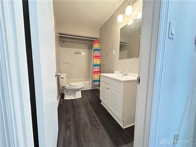 full bathroom with shower / tub combo, vanity, hardwood / wood-style flooring, and toilet