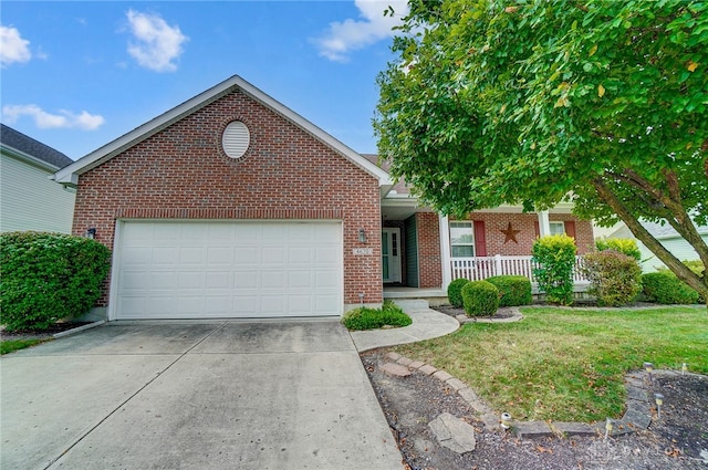 front of property with a garage, covered porch, and a front yard