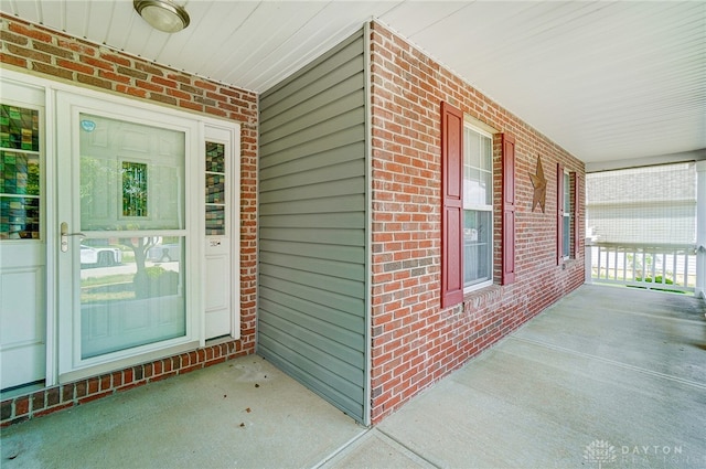 entrance to property featuring a porch